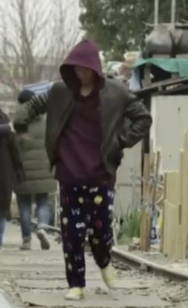 Nam Goong Min in maroon hoodie, gray jacker, figured pajama pants and lemon yellow converse