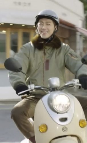 Nam Giong Min wears a ripstop jacket with brown shearling collar and matching helmet